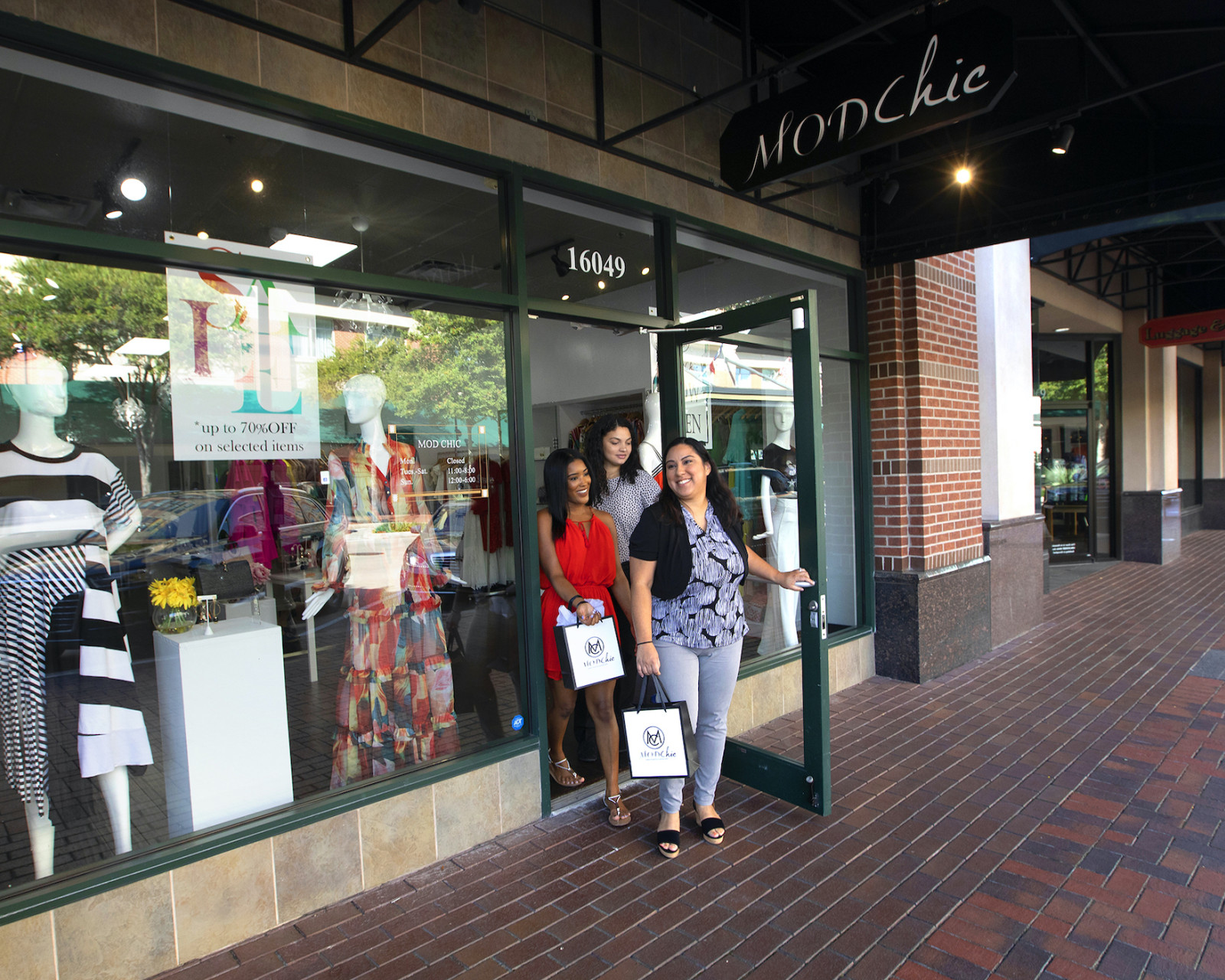 Helping Small Business Thrive - Women Walking Out of Store